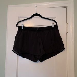 Running shorts with zip picket and tie waist.